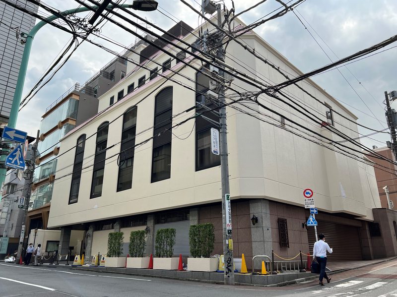 The Family Federation for World Peace and Unification headquarters building in Shibuya, Tokyo, seen from the street.